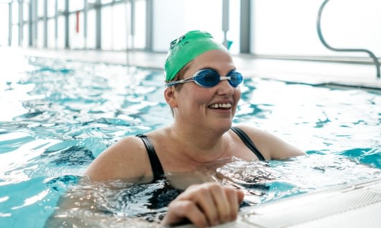 Lady in pool smiling